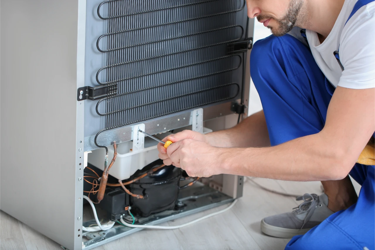 refrigerator-repairman-fixing-appliance